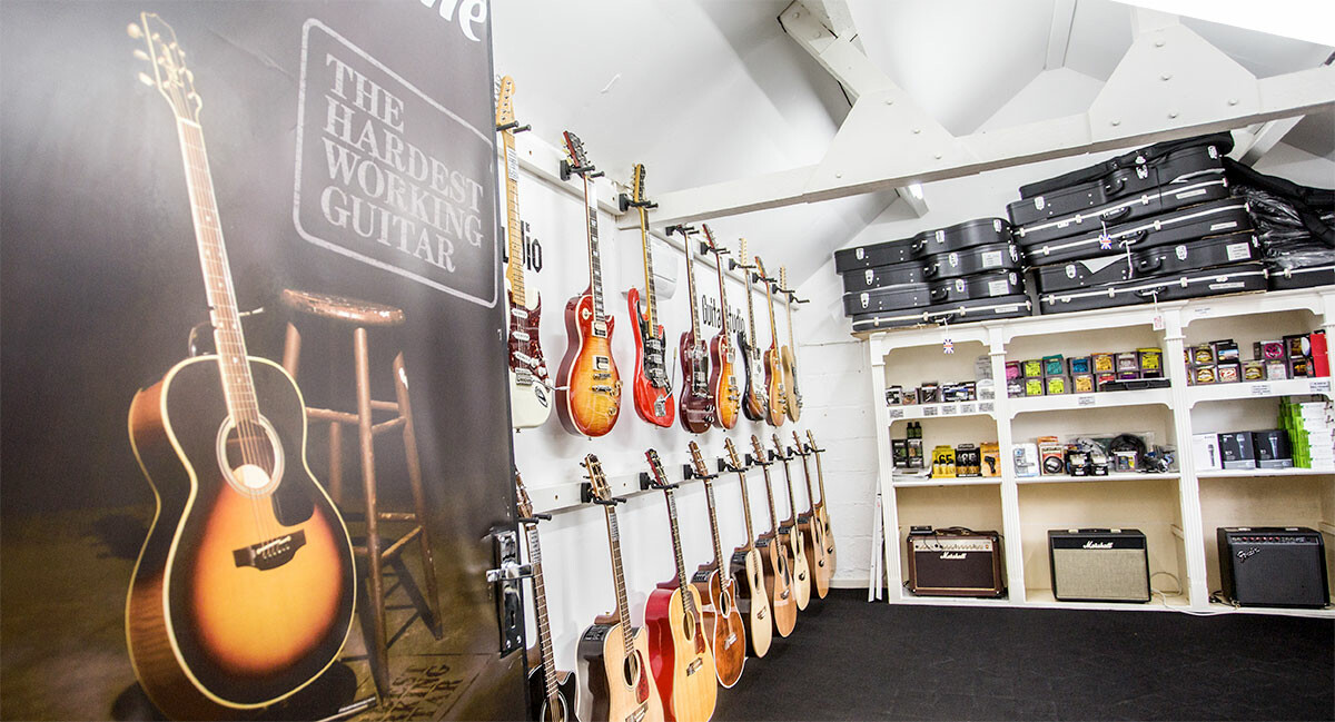 inside the retail shop of guitar studio
